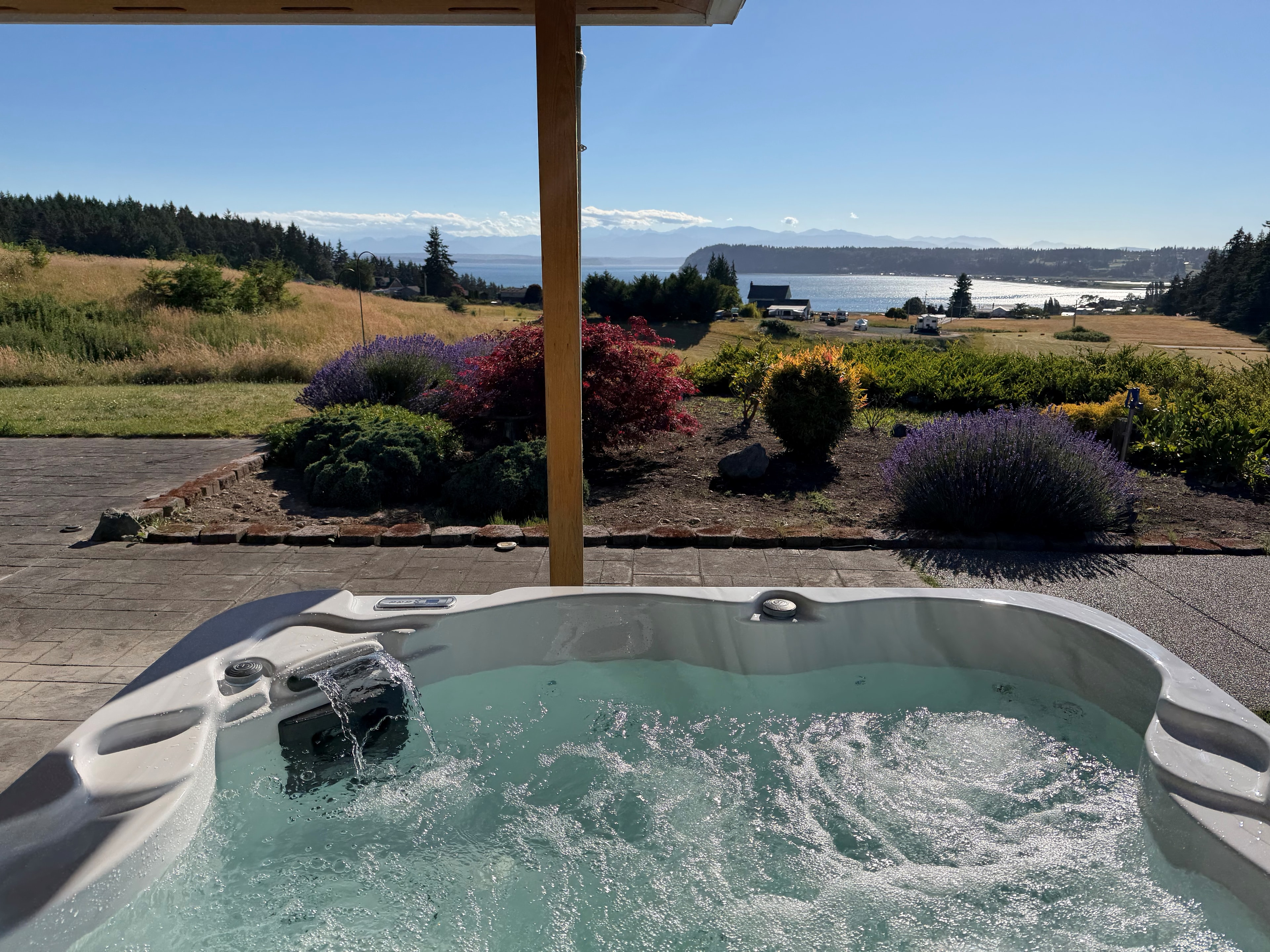 Hot tub on waterfront deck with Puget Sound views